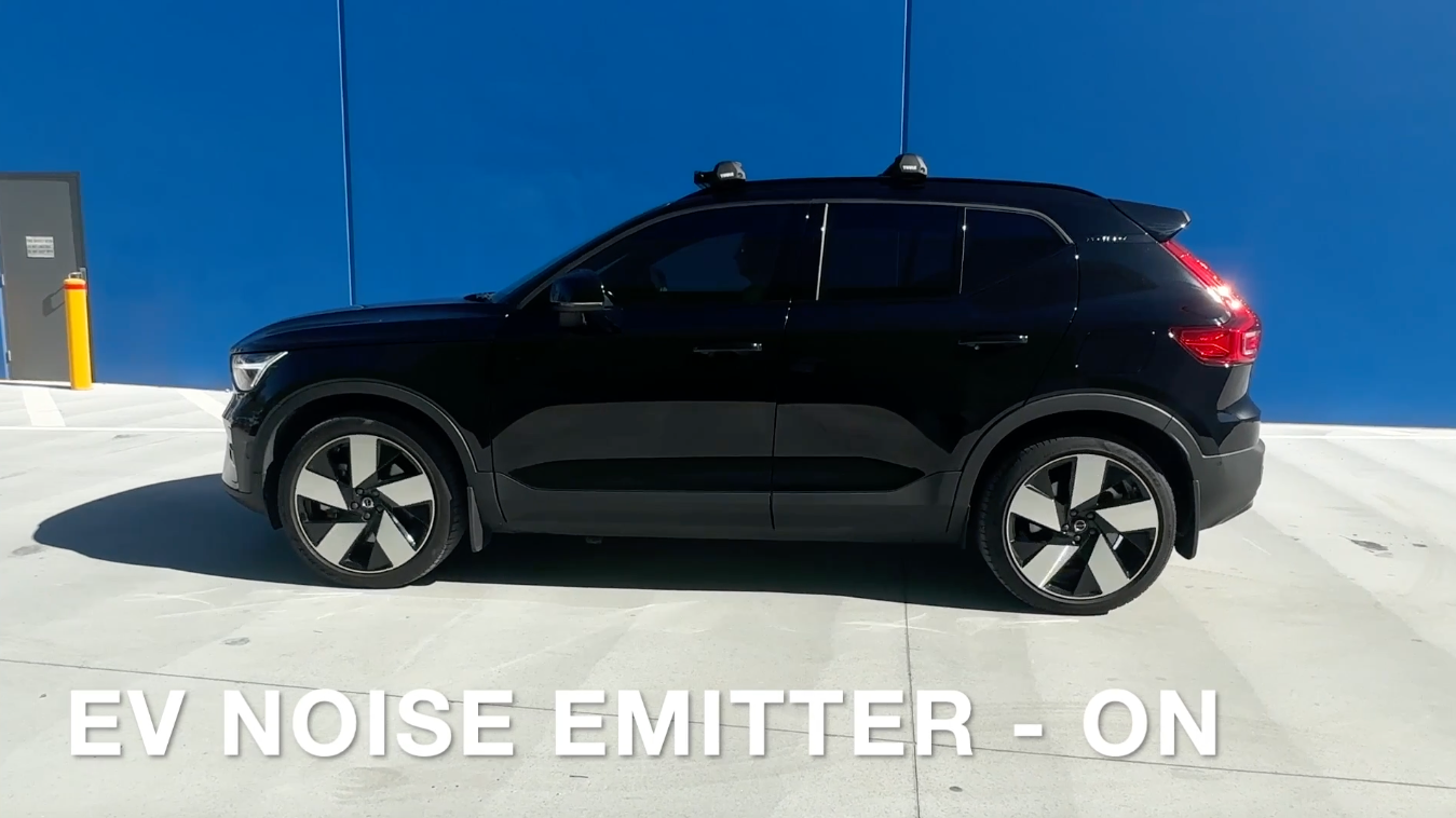 Demonstration video of a customer with a Just Add Noise EV Noise emitter, turning on an example audio file. Other vehicle traffic can be hear, while the EV is silent. Turning on the EV Noise Emitter allows the EV to be heard.